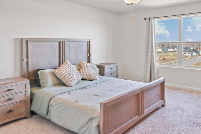 bedroom featuring light carpet