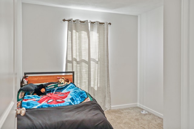 bedroom with light carpet