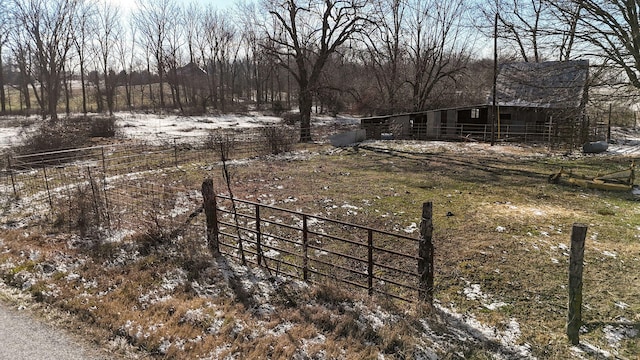 view of yard with a rural view