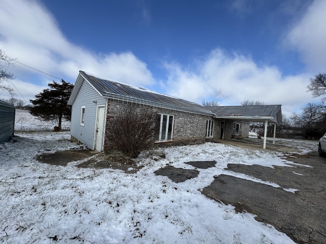 view of snow covered property