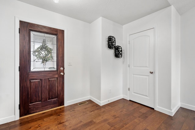 foyer featuring dark wood-type flooring