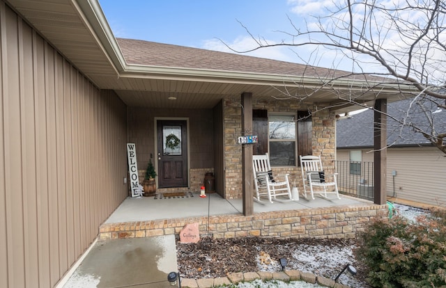 entrance to property featuring covered porch