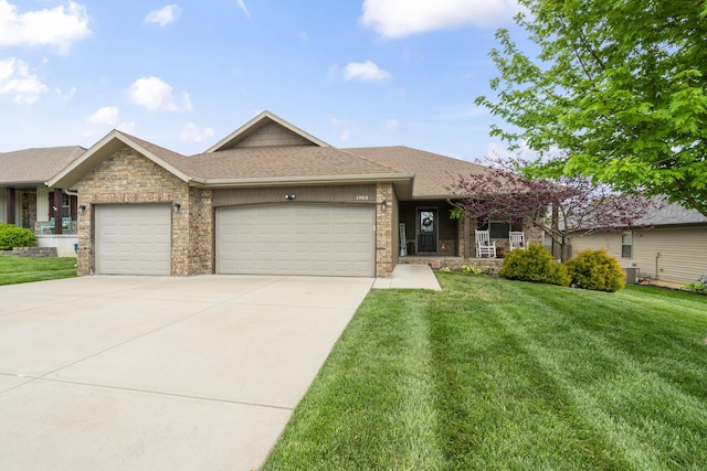 ranch-style house with a front yard, a shingled roof, brick siding, concrete driveway, and an attached garage