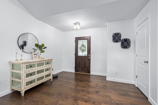 entrance foyer with baseboards and dark wood finished floors