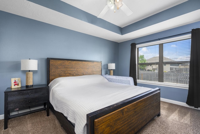 bedroom with baseboards, a ceiling fan, and carpet flooring