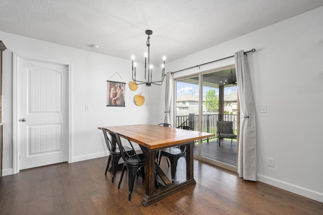 dining space featuring baseboards, a chandelier, and dark wood-style floors