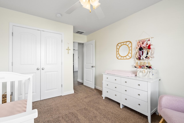 bedroom with visible vents, ceiling fan, a closet, baseboards, and carpet floors