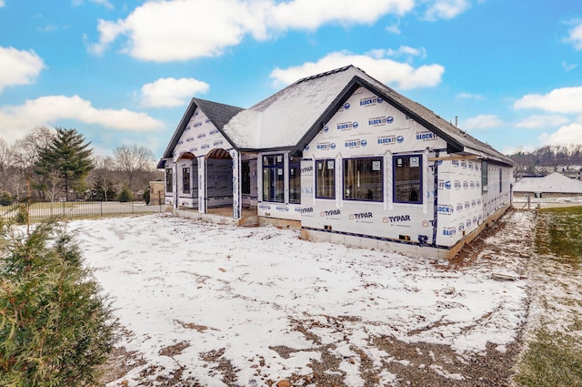 view of snow covered house