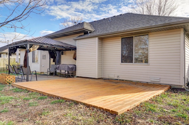 back of house with a gazebo and a deck