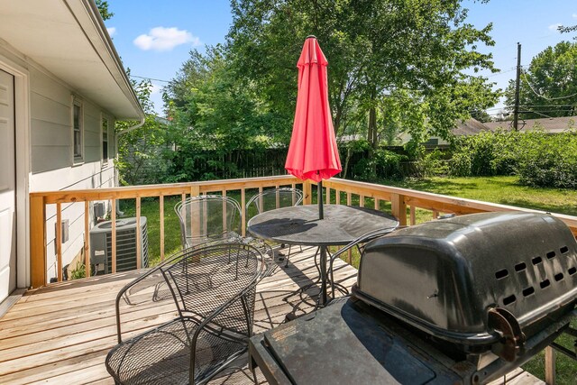 wooden terrace with area for grilling and cooling unit