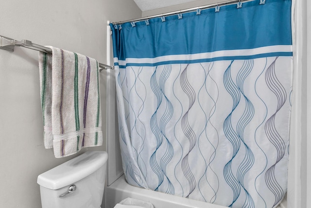 bathroom featuring shower / bathtub combination with curtain