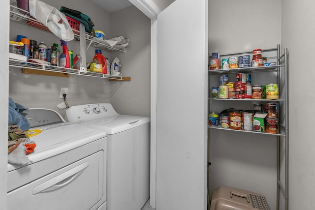 laundry area with washing machine and clothes dryer