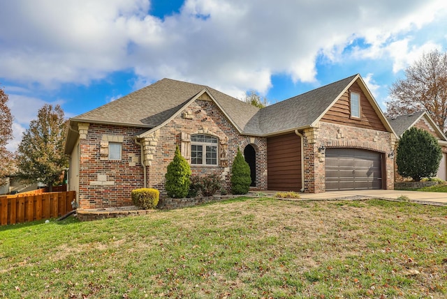 view of front of home with a garage and a front yard