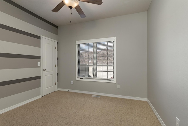 empty room with carpet and ceiling fan