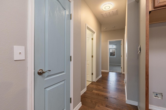 hallway featuring dark wood-type flooring