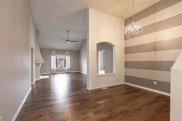 interior space featuring ceiling fan with notable chandelier, dark hardwood / wood-style floors, and high vaulted ceiling