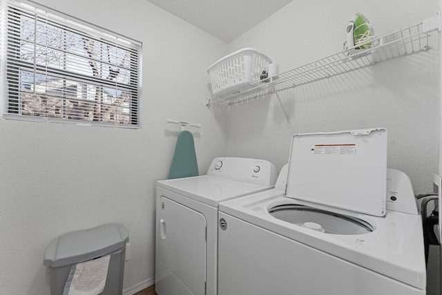 laundry room with washing machine and clothes dryer