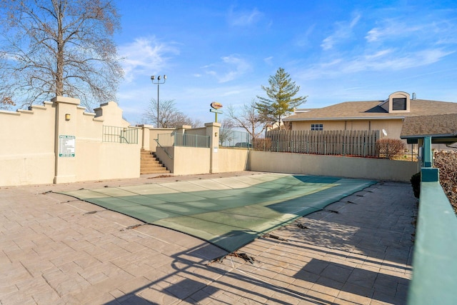 view of swimming pool with a patio