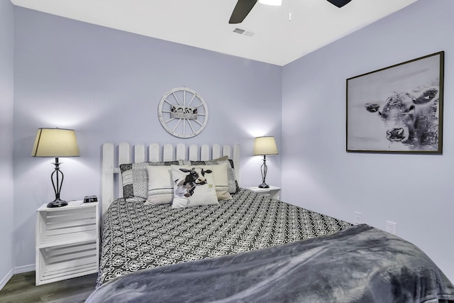 bedroom featuring ceiling fan and dark hardwood / wood-style floors