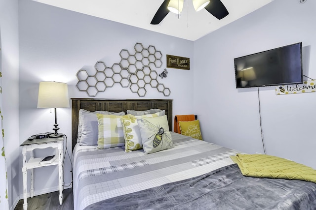 bedroom featuring hardwood / wood-style floors and ceiling fan