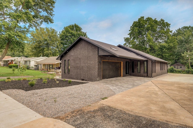 view of side of home with a garage