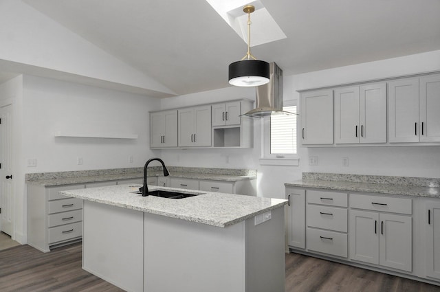 kitchen featuring island range hood, a kitchen island with sink, lofted ceiling, and sink