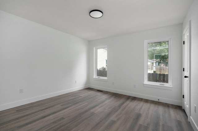 empty room featuring dark hardwood / wood-style floors