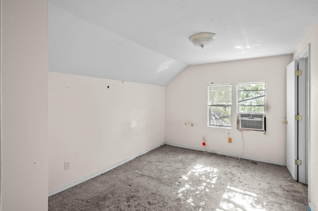 additional living space featuring carpet, cooling unit, and vaulted ceiling