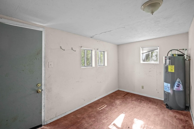 basement featuring electric water heater