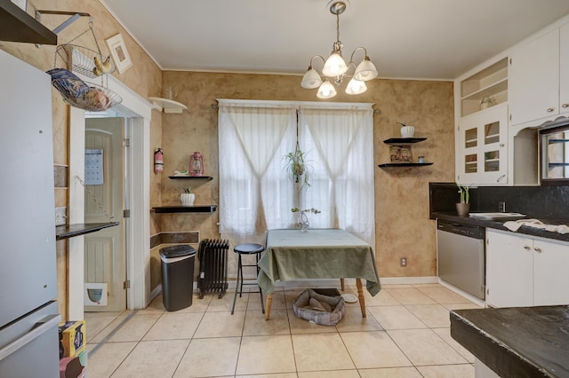 dining area with built in features, an inviting chandelier, and light tile patterned flooring