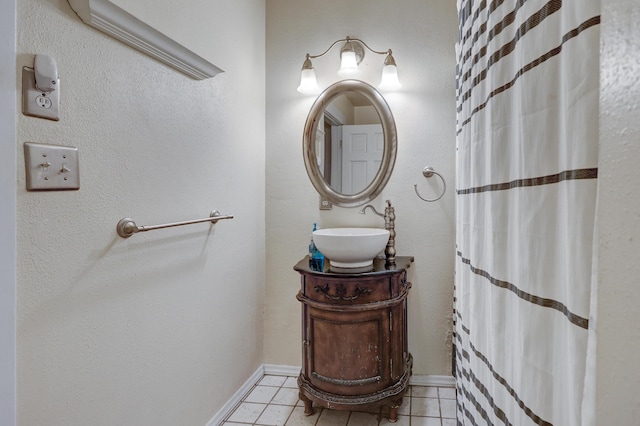 bathroom featuring a shower with shower curtain, vanity, and tile patterned floors