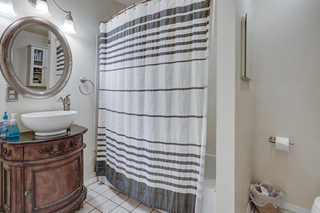 bathroom featuring tile patterned flooring and vanity