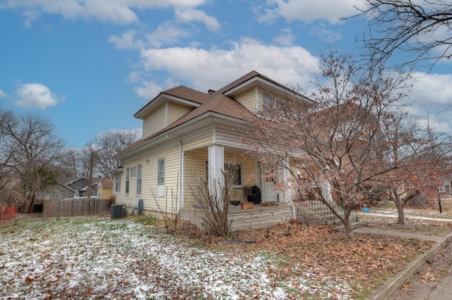 view of side of property with central AC