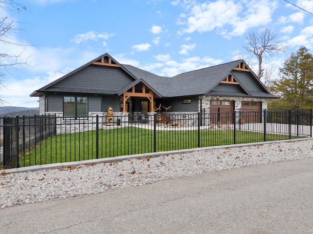 view of front of home with a front yard and a garage