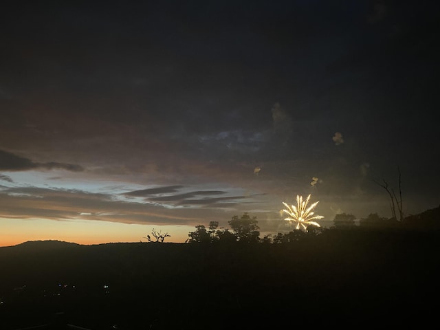 nature at dusk featuring a mountain view