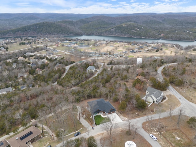 drone / aerial view with a water and mountain view