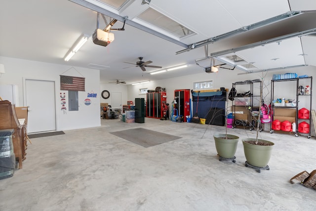 garage with electric panel, a garage door opener, and ceiling fan