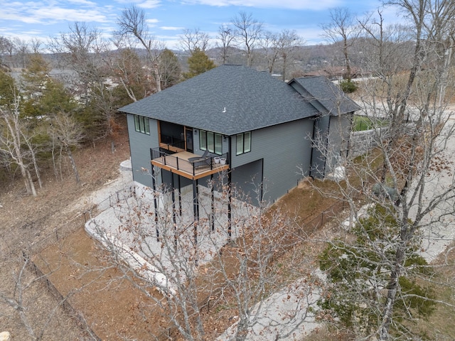 back of property with a balcony