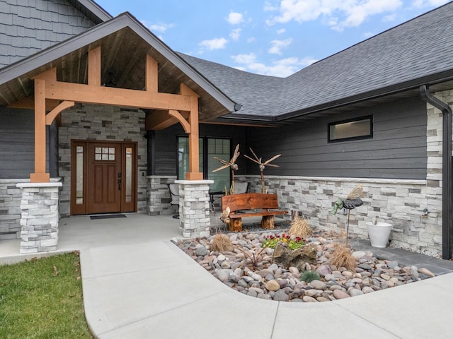 view of exterior entry featuring a porch