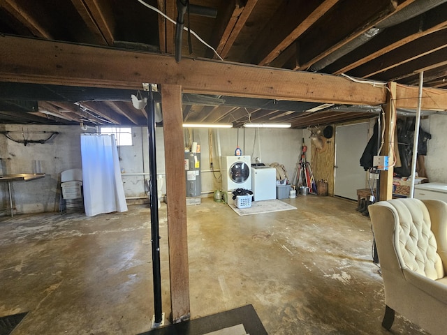 basement with washing machine and dryer and water heater