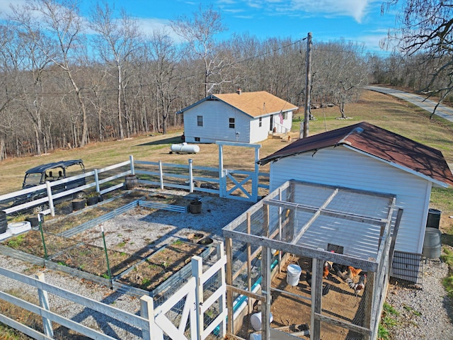 21525 State Highway P, Ava, MO 65608 - view of home's exterior with a vegetable garden and an outbuilding