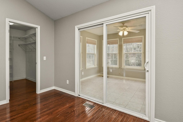 unfurnished bedroom featuring ceiling fan and wood-type flooring