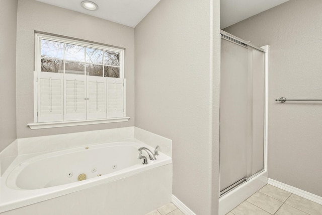 bathroom with tile patterned floors and separate shower and tub