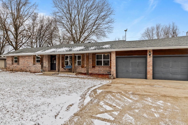 ranch-style house with a porch and a garage