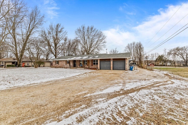 ranch-style house featuring a garage