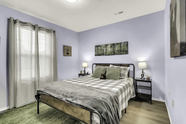 bedroom featuring wood-type flooring