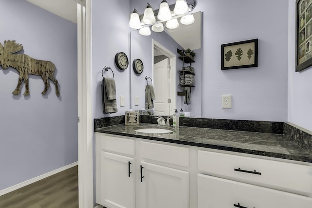 bathroom with hardwood / wood-style floors and vanity