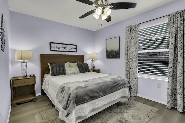 bedroom featuring hardwood / wood-style floors and ceiling fan