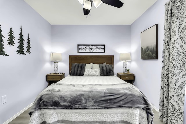 bedroom featuring ceiling fan and hardwood / wood-style floors