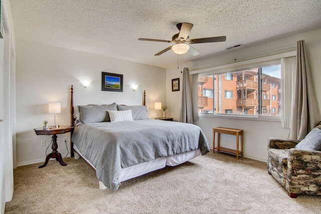 189 Avondale Dr Unit 91-6, Branson, MO 65616 - bedroom featuring a textured ceiling, ceiling fan, and light carpet